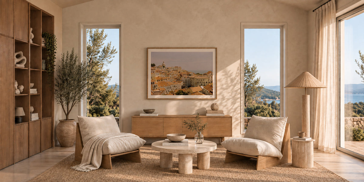 Framed analog film print of Lisbon rooftops at golden hour above an oak sideboard in a Mediterranean living room