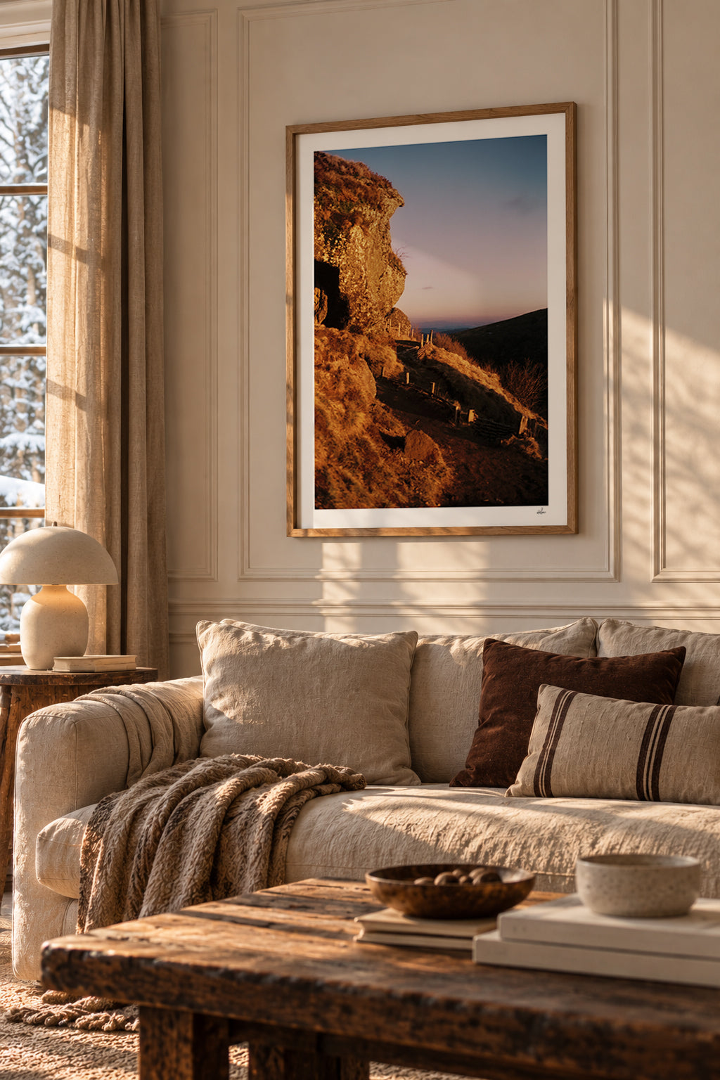 Golden winter light on a volcanic rock at the Puy de Clierzou, Auvergne, France — framed print in a warm minimalist living room
