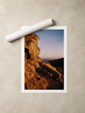Golden winter light on a volcanic rock at the Puy de Clierzou, Auvergne, France — unframed fine art print lying flat beside a rolled print