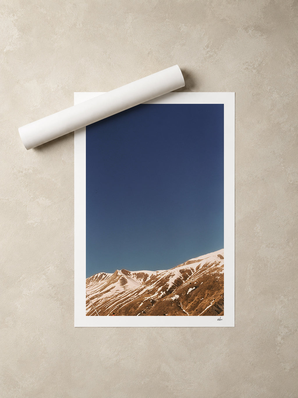 Snow-streaked ridges under a deep blue sky, French Alps, France — unframed fine art print lying flat beside a rolled print