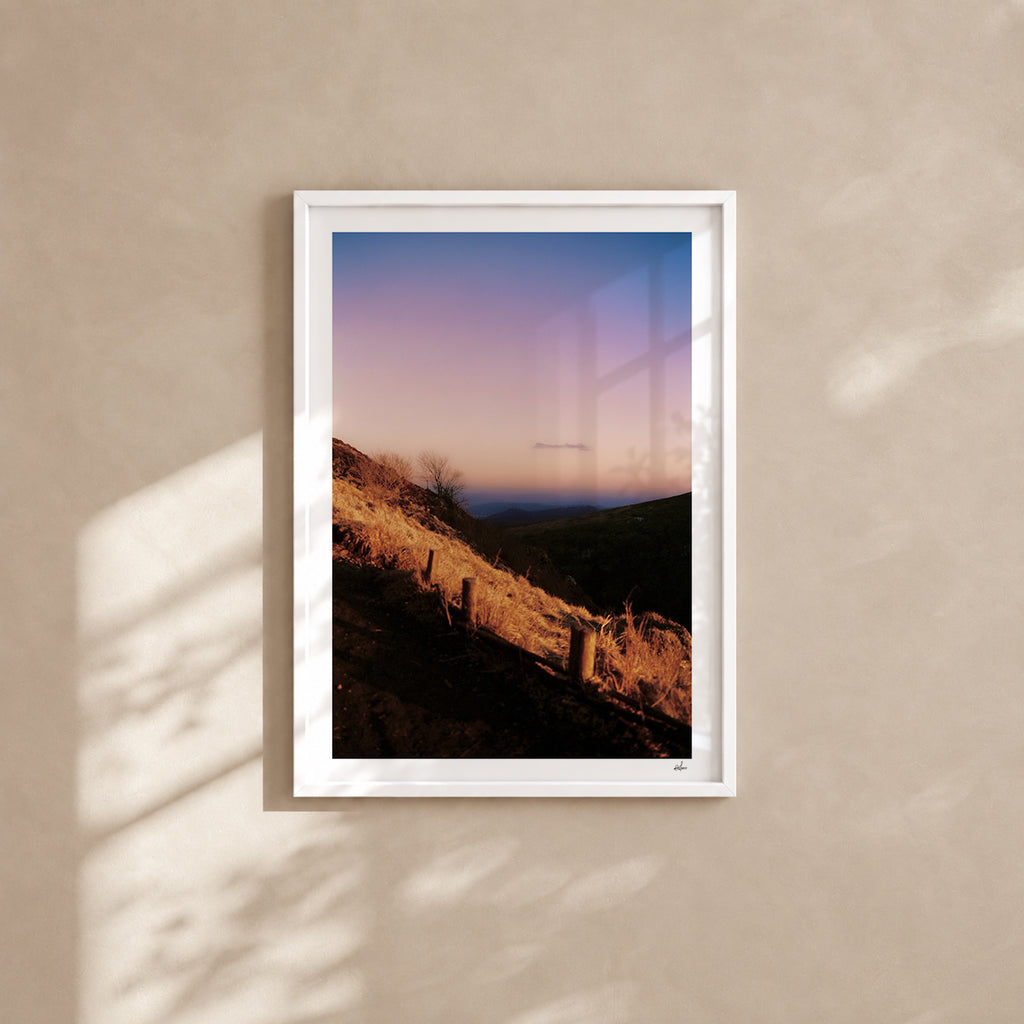 Winter dusk over the Chaîne des Puys, Auvergne, France — analog film photography print in a white wood frame