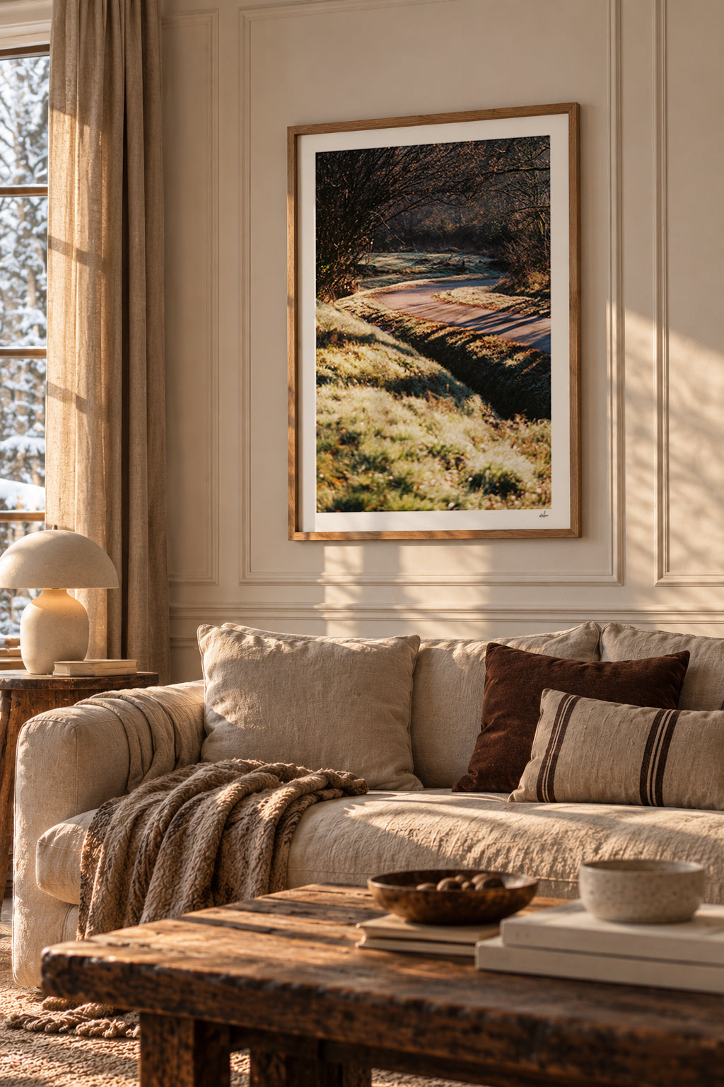 Frosted country lane in low winter sun, Auvergne, France — framed print in a warm minimalist living room